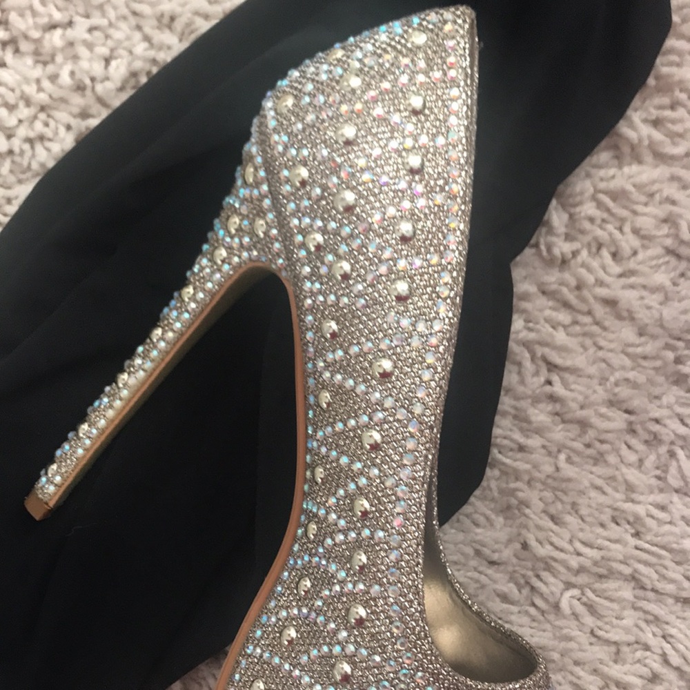 Completely bejeweled with gold and iridescent beading platform peep toe pumps!